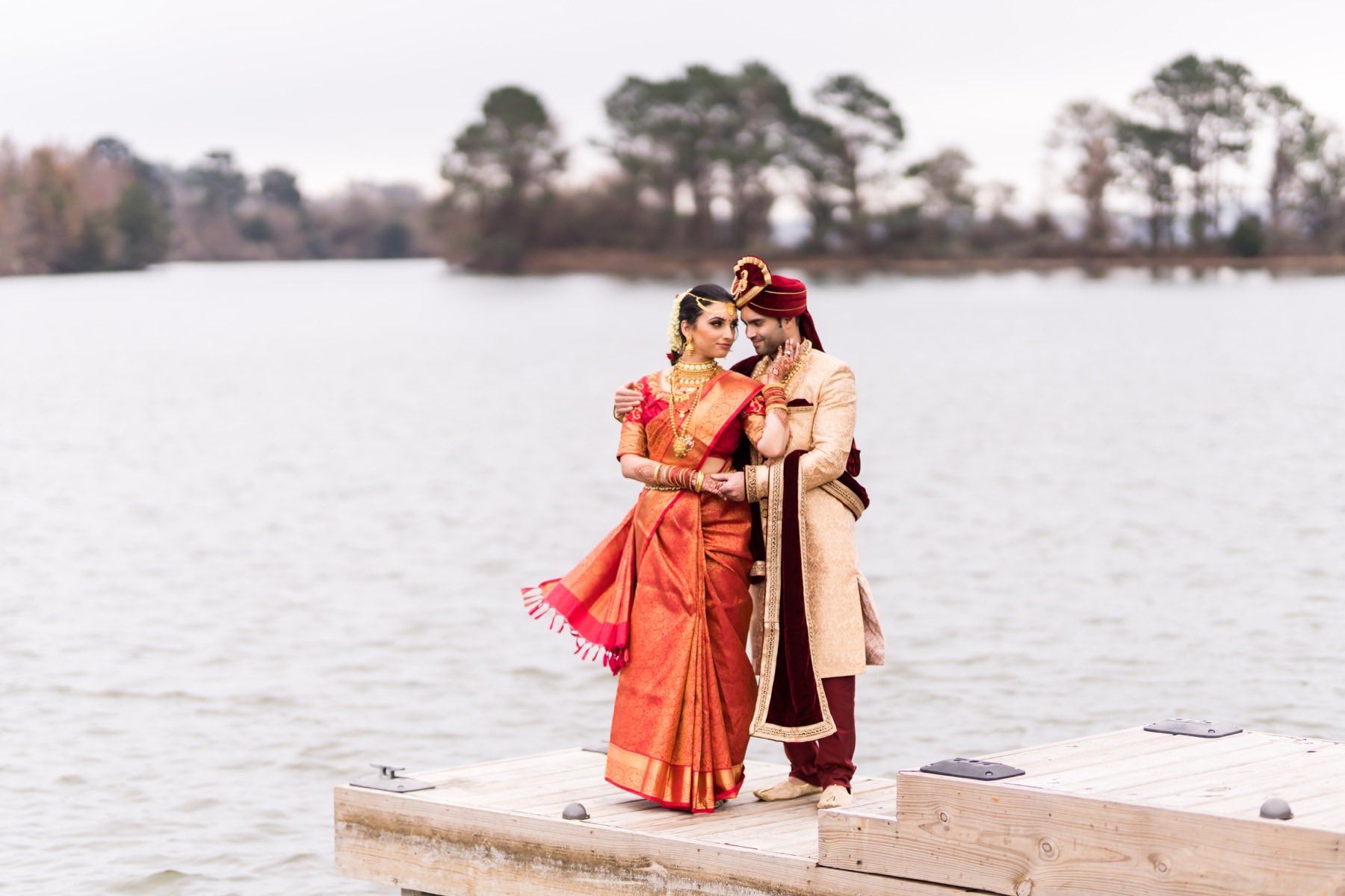 Striking wedding portrait with dramatic floral arrangements